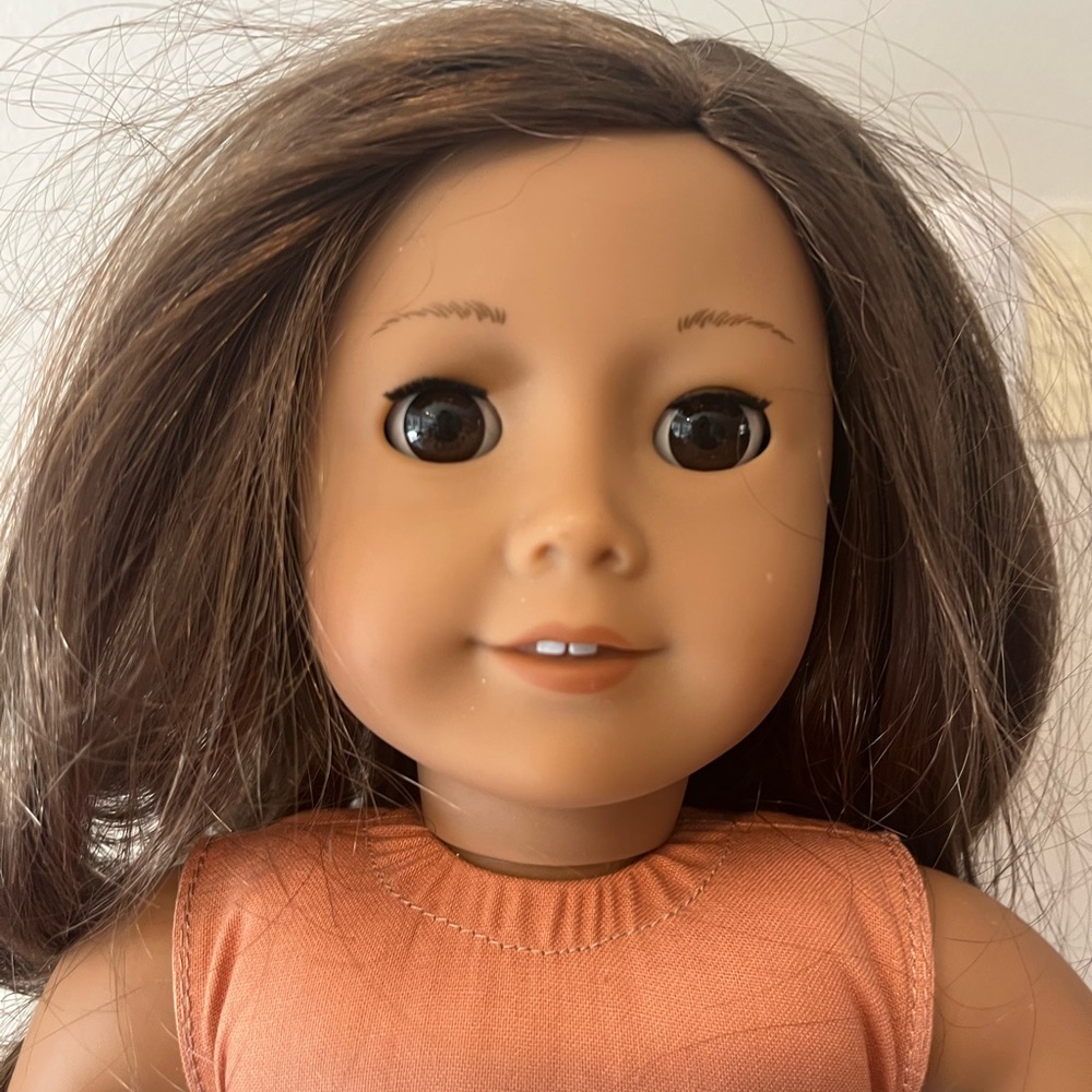 American Girl Doll with Brown Hair and Orange Outfit